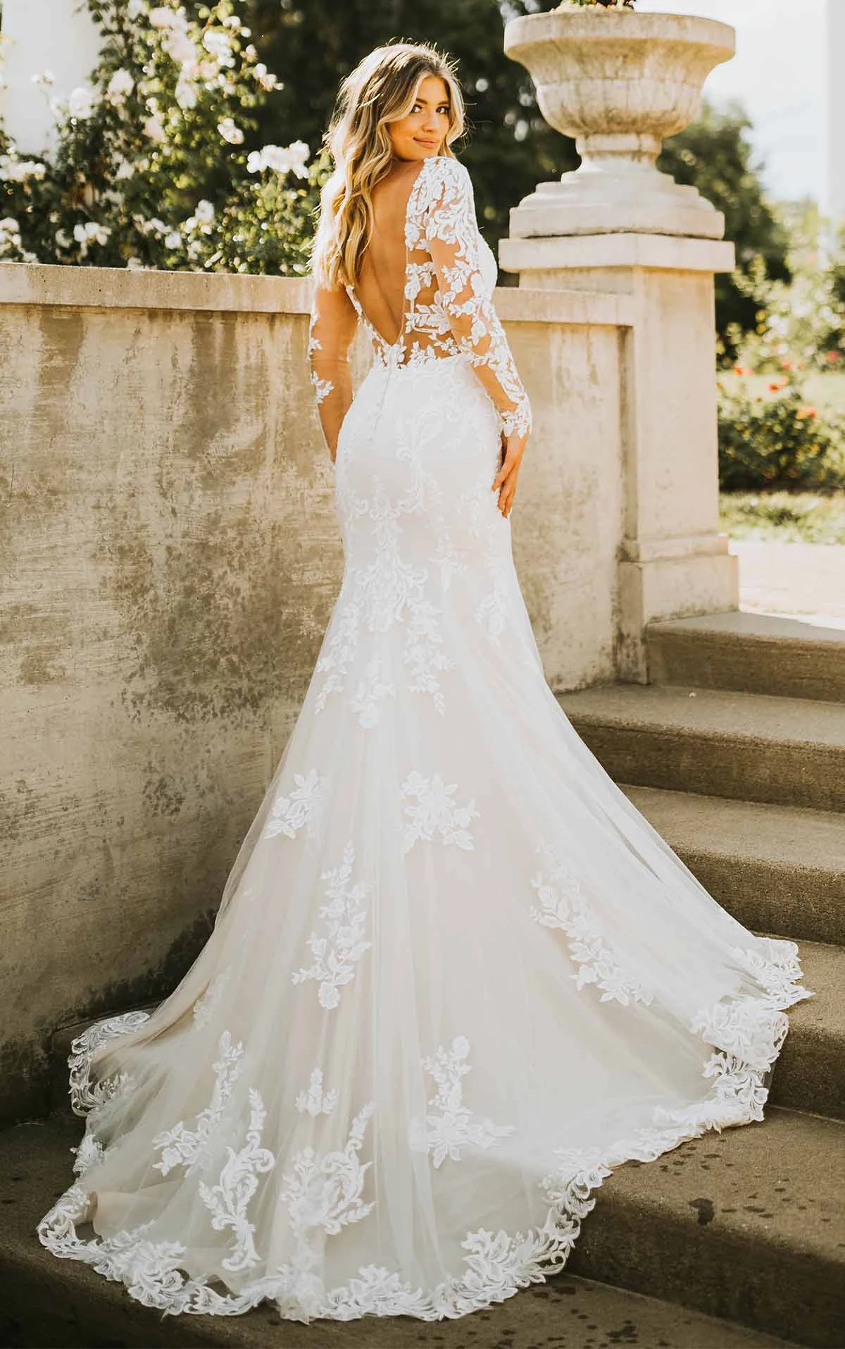 7420 Sexy Long-Sleeve Lace Wedding Dress with Cutouts and Full Train  by Stella York